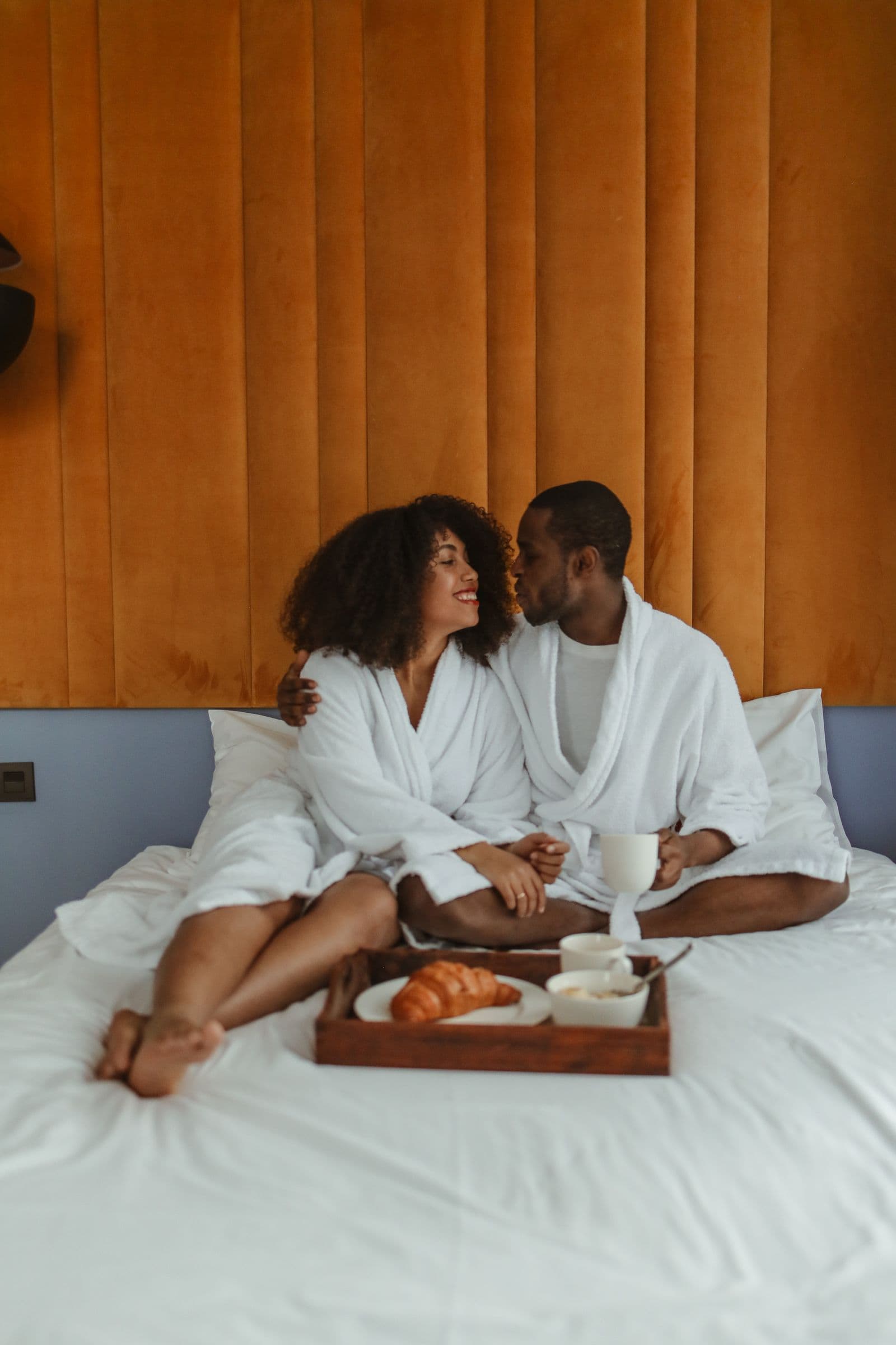 Couples sensual session — two people in robes, close and unhurried